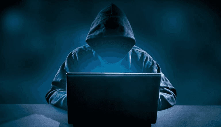 Obligatory hacker in a hoodie at keyboard